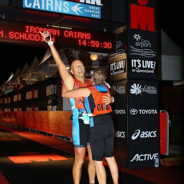 "An elated Mick being embraced at the end of the Cairns Ironman competition. "