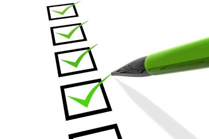Green pen ticking a list of boxes.